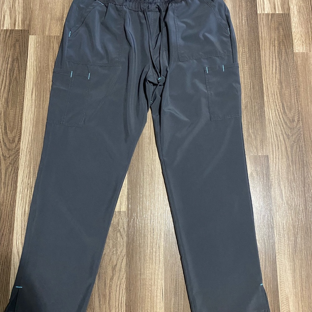Size M scrub set. Top and bottom same color. Lighting makes them look different